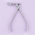 Buccal tube convertible cap removing plier: plier for lifting the convertible cap from a buccal tube