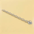 Button chain: bondable button with an attached chain