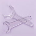 Occlusal Cheek Retractor: occlusal cheek retractor holding the cheeks clear for occlusal-view photographs
