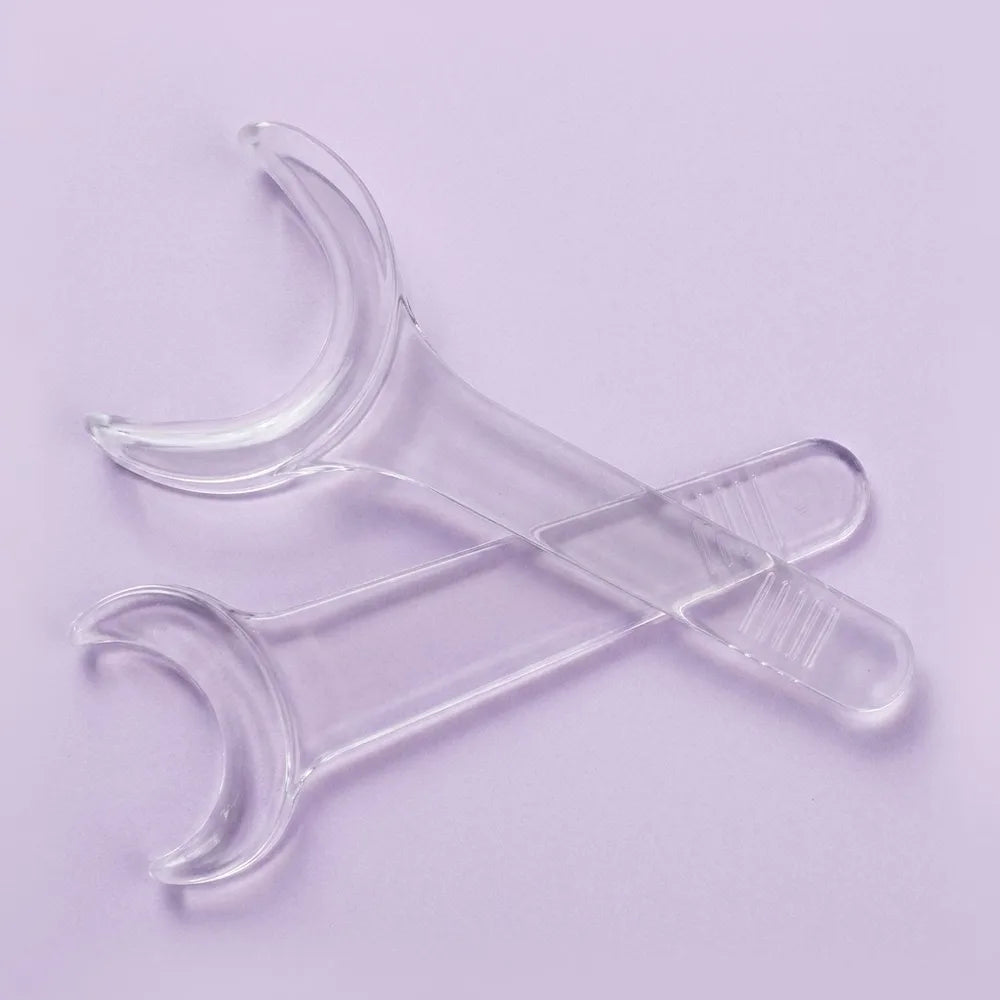 Occlusal Cheek Retractor: occlusal cheek retractor holding the cheeks clear for occlusal-view photographs