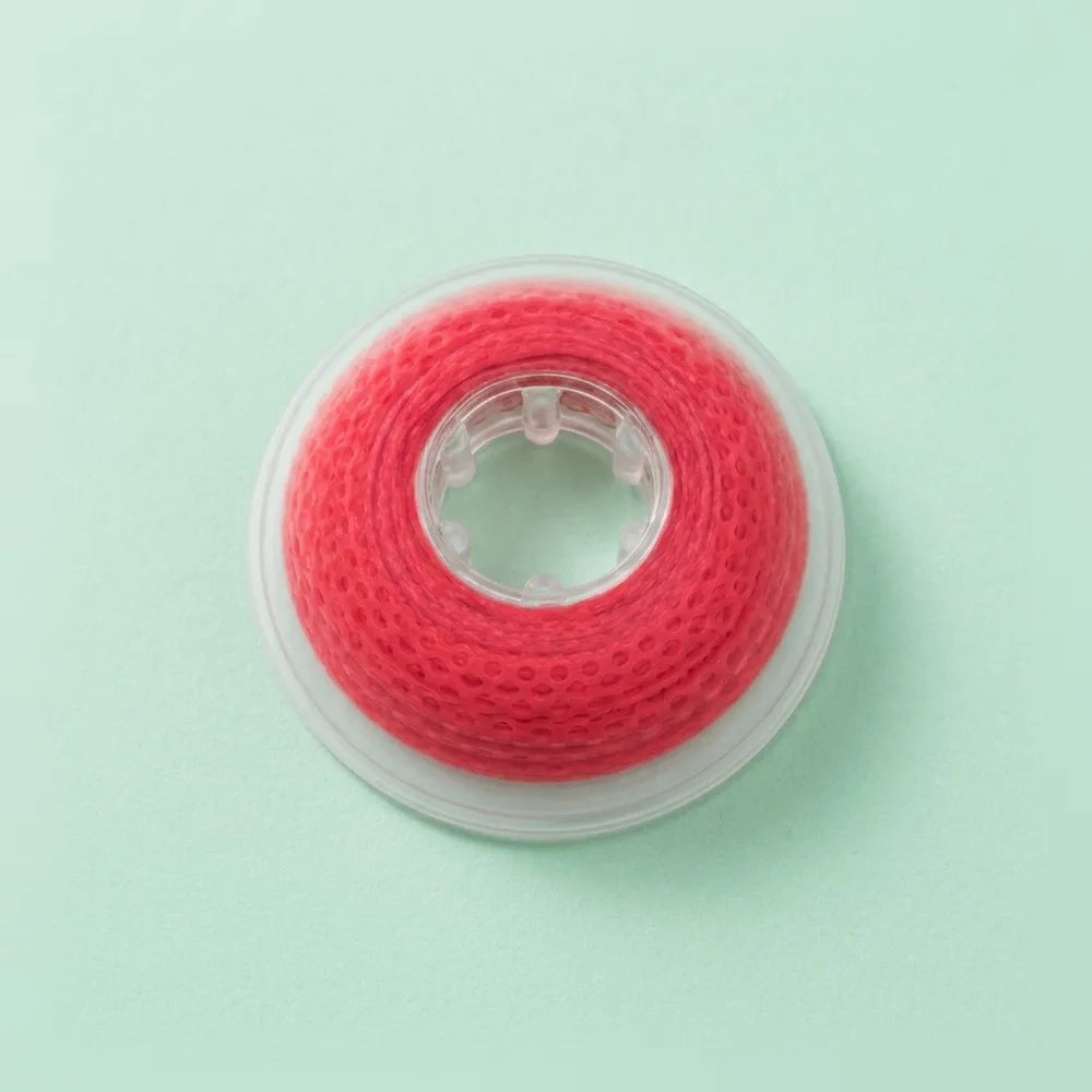 Spool of red elastomeric power chain