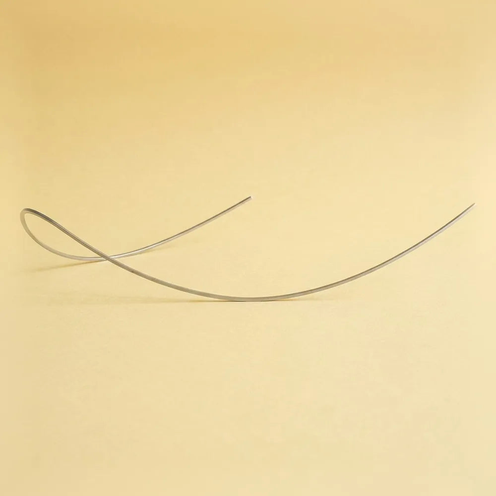 Reverse curve NiTi archwire showing its exaggerated curve of Spee